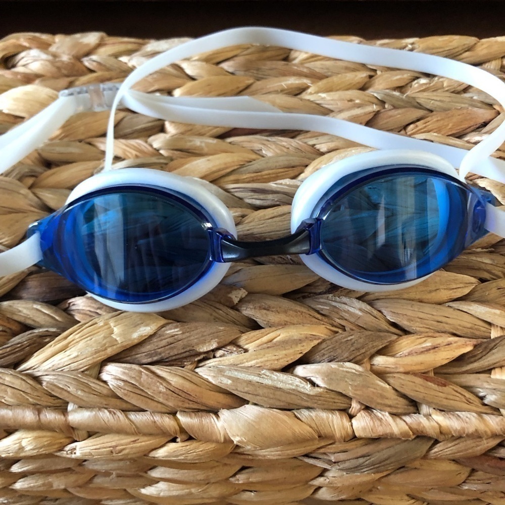 White and blue swim goggles